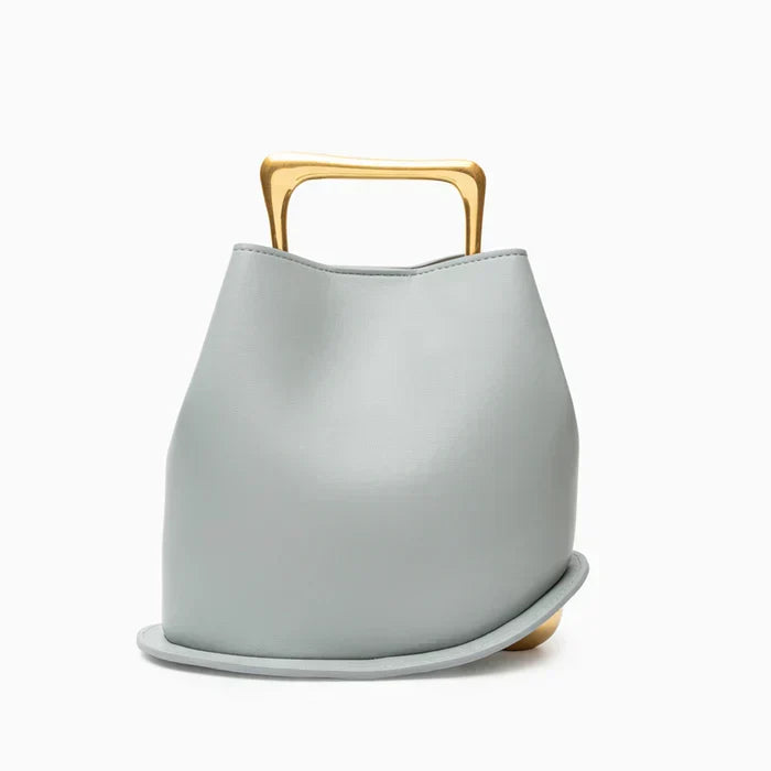 Bolso bucket minimalista con asa dorada — modelo Soralla (imagen 3)